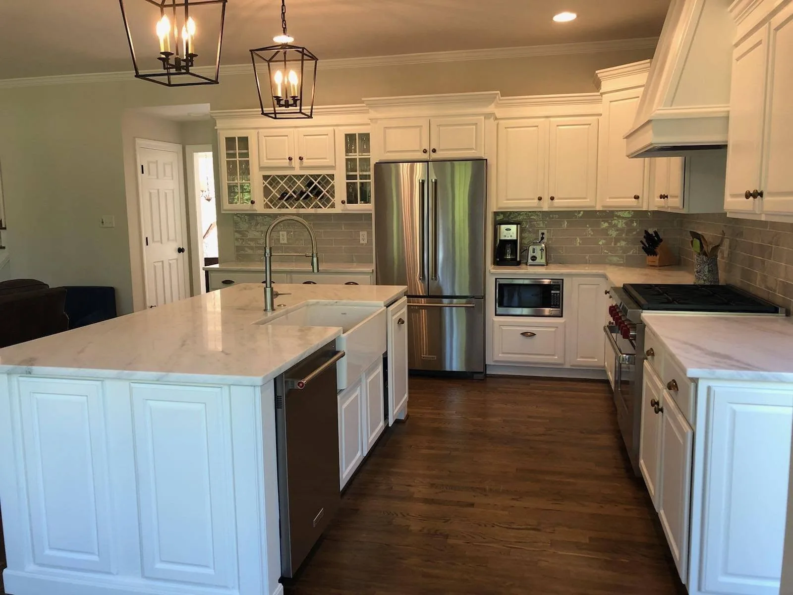White kitchen cabinetry with custom butcher-block countertop