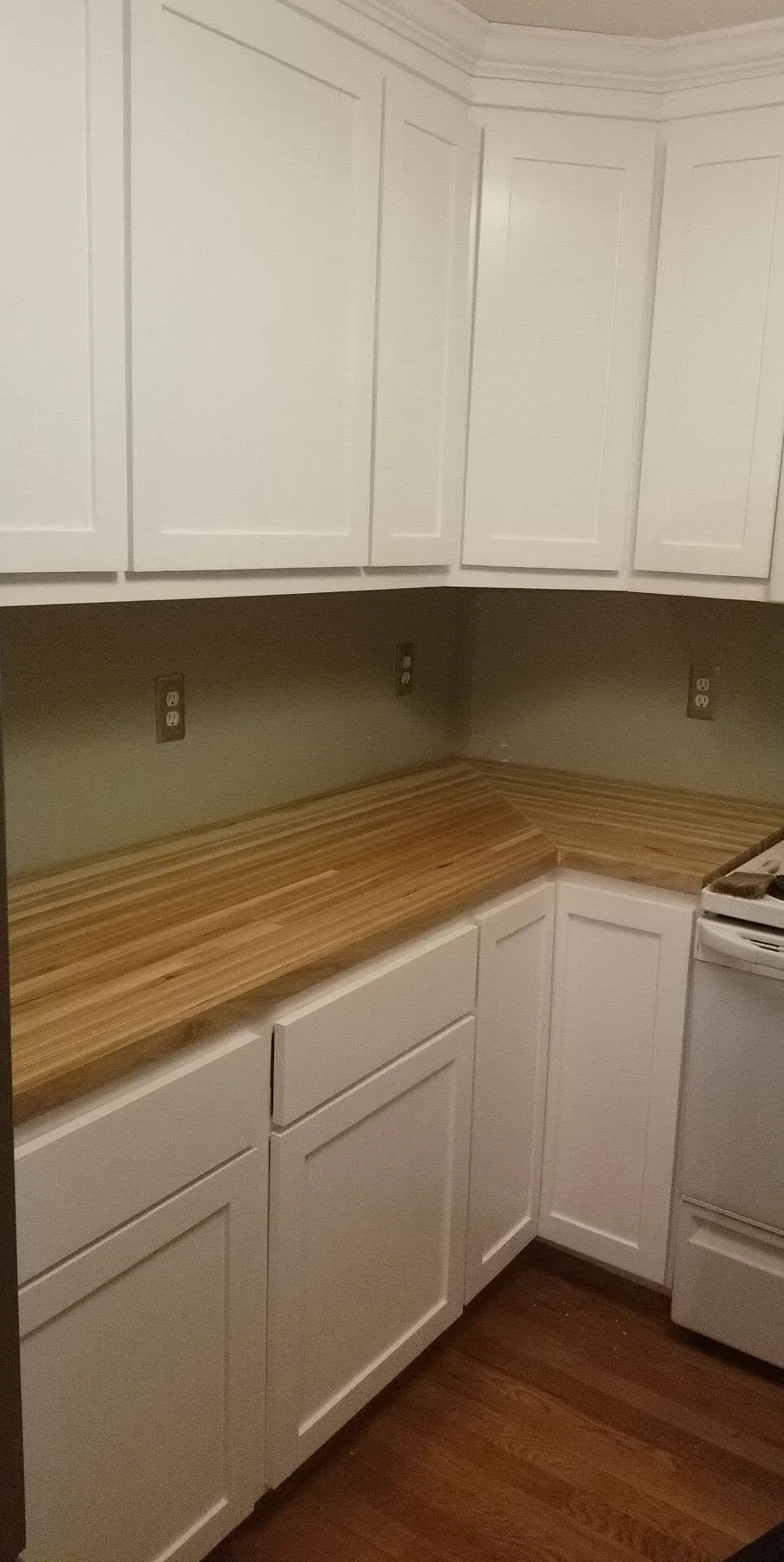 Completed white custom kitchen cabinetry and island